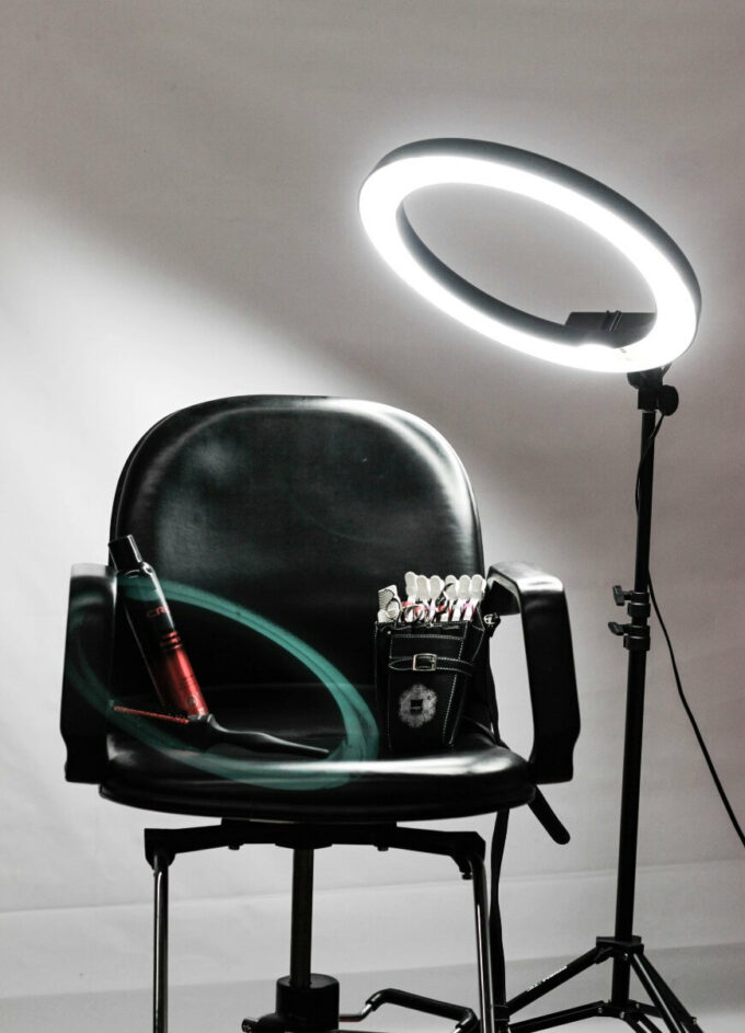 hairdresser chair with products and ring light