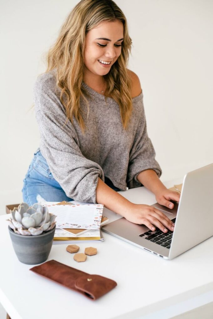 woman typing on laptop