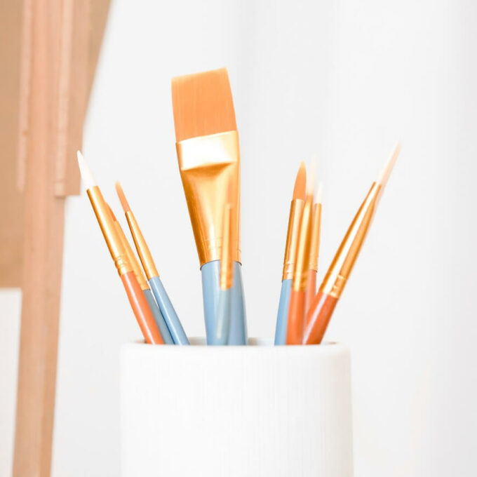 paintbrushes in a jar