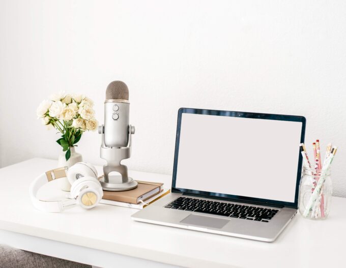 laptop and microphone for a podcaster