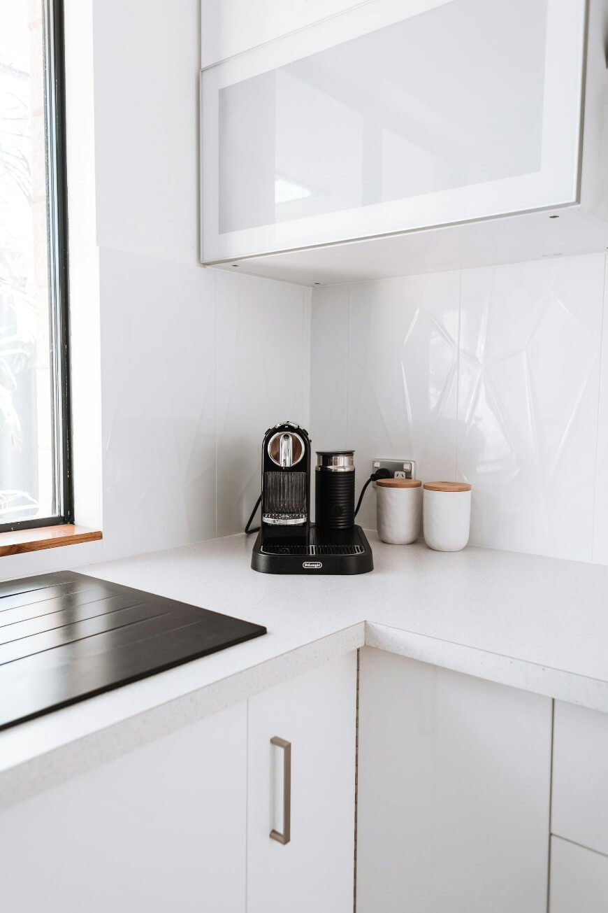 white kitchen and coffee machine